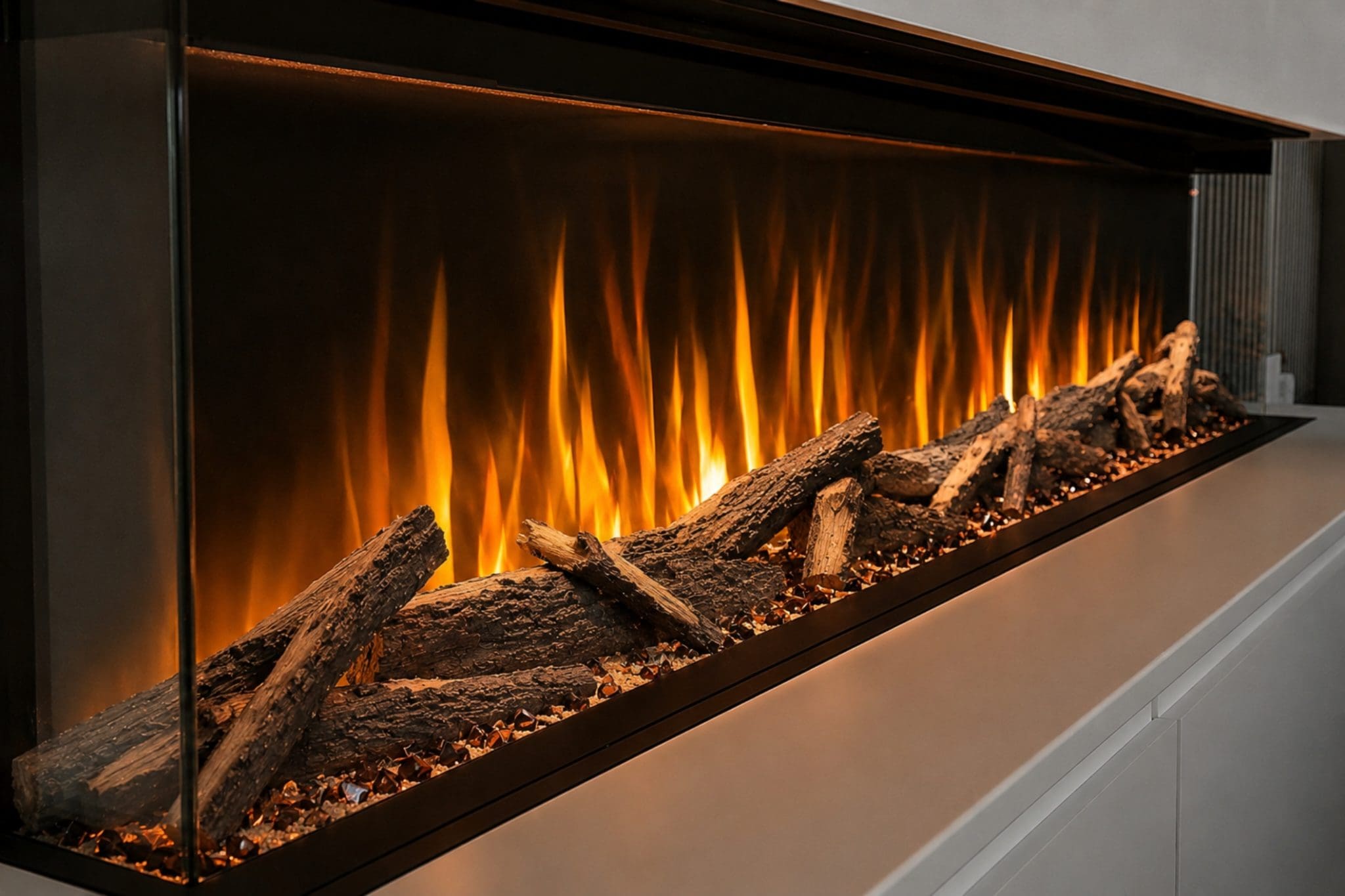 Advance Series electric fireplace angled close-up showing realistic Woodland logs, glowing fuel bed and panoramic orange flame effect from Evolution Fires.