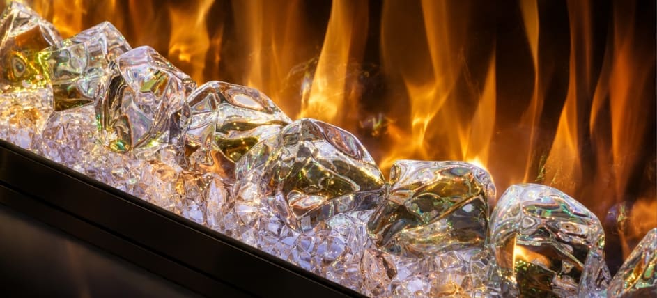 Spectrum electric fireplace crystal fuel bed close-up with large clear crystals, glowing ember detail and realistic flame effect.